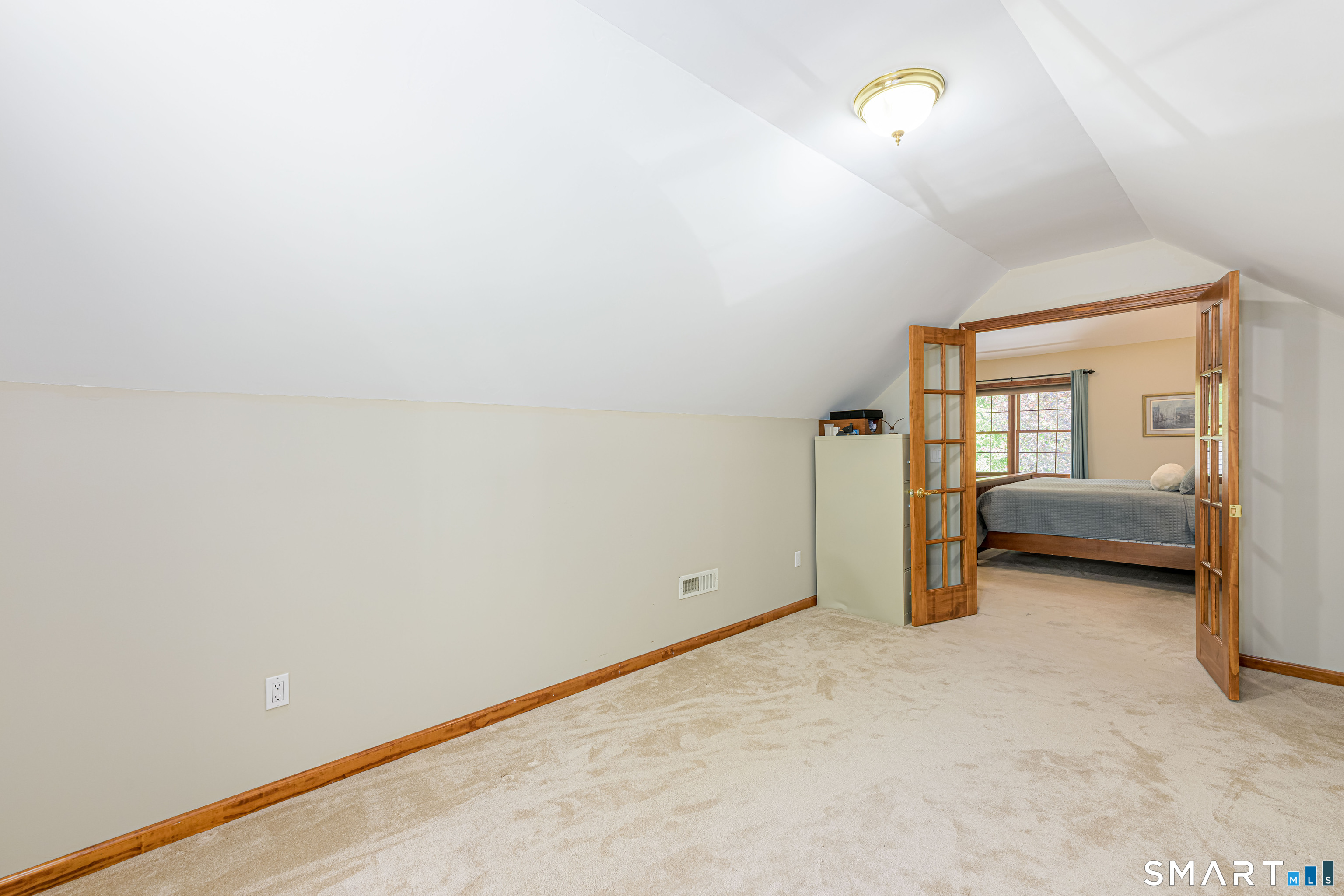 4 Crystal Lane Wallingford, CT 06492 - Photo 19 of 40 a view of a room with an empty space and a ceiling fan
