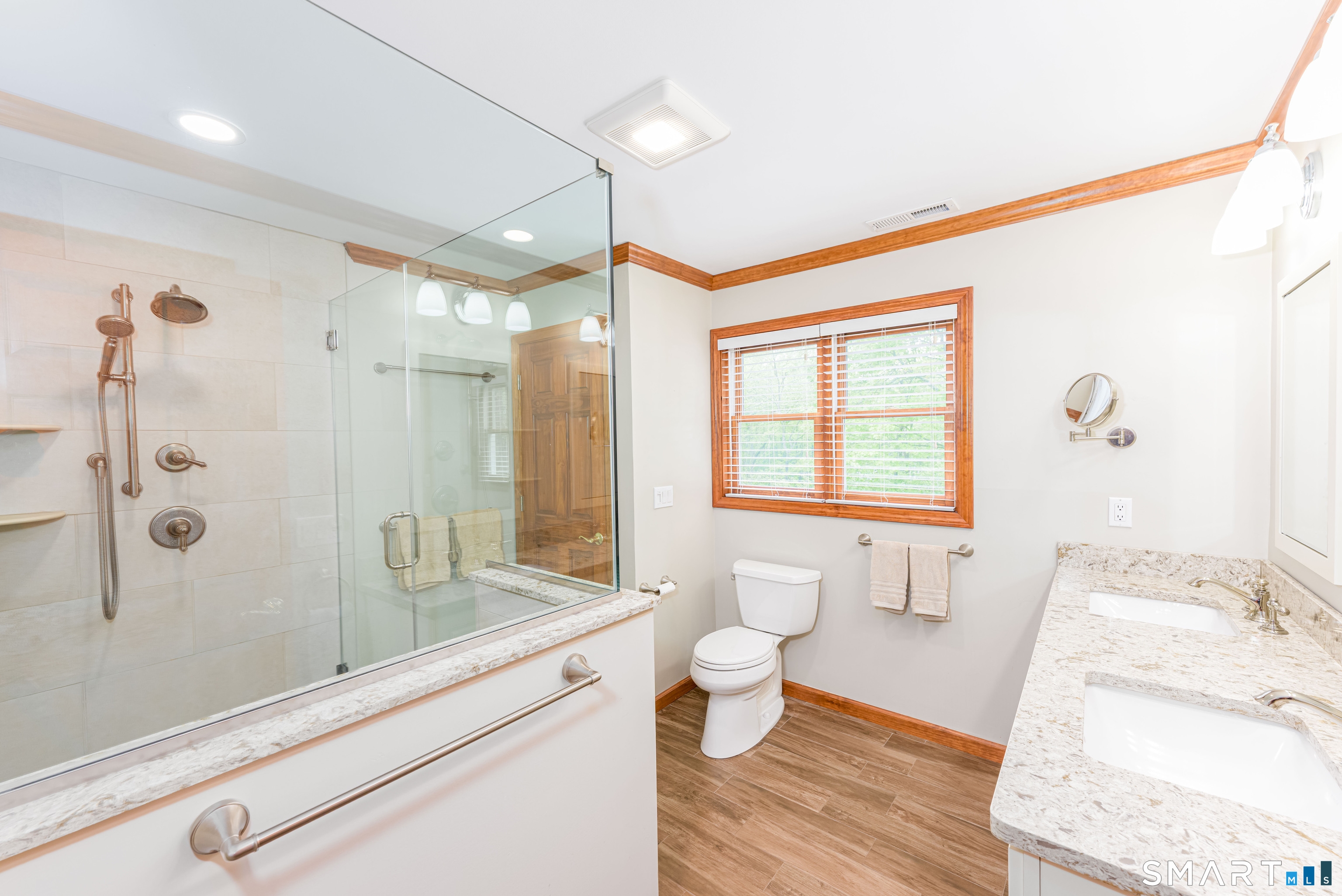 4 Crystal Lane Wallingford, CT 06492 - Photo 22 of 40 a spacious bathroom with a granite countertop sink a toilet and shower