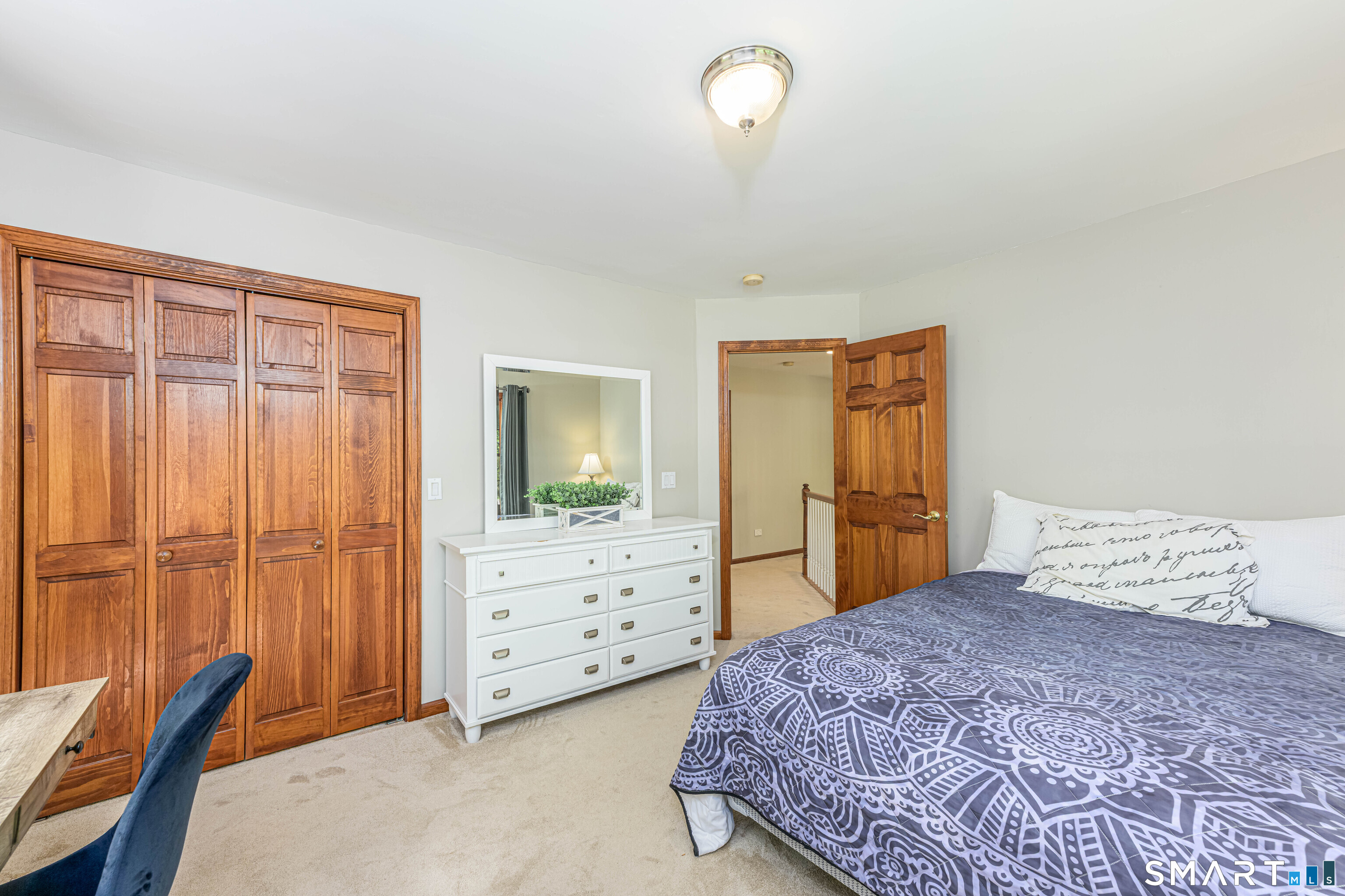 4 Crystal Lane Wallingford, CT 06492 - Photo 28 of 40 a bedroom with a bed and a dresser