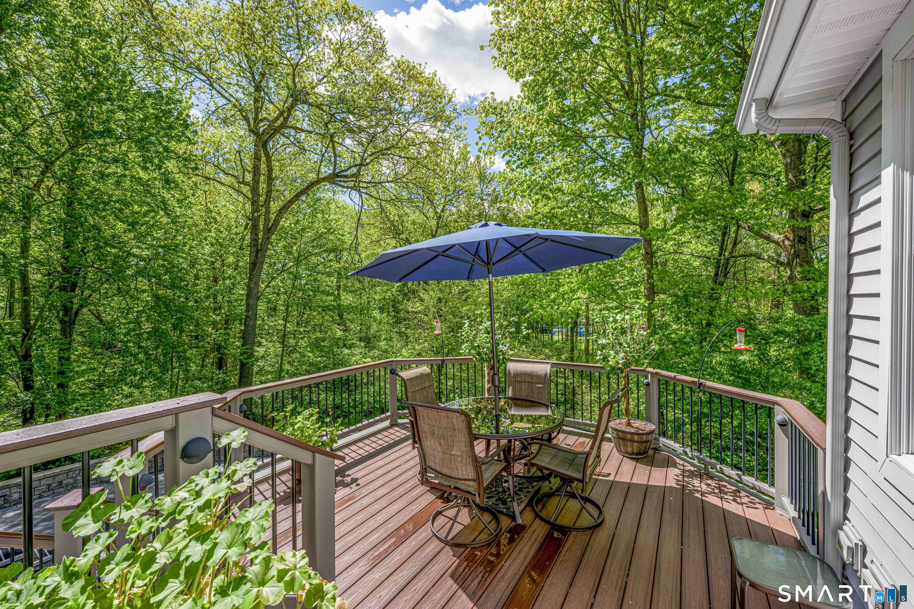 4 Crystal Lane Wallingford, CT 06492 - Photo 34 of 40 a view of balcony with furniture and umbrella