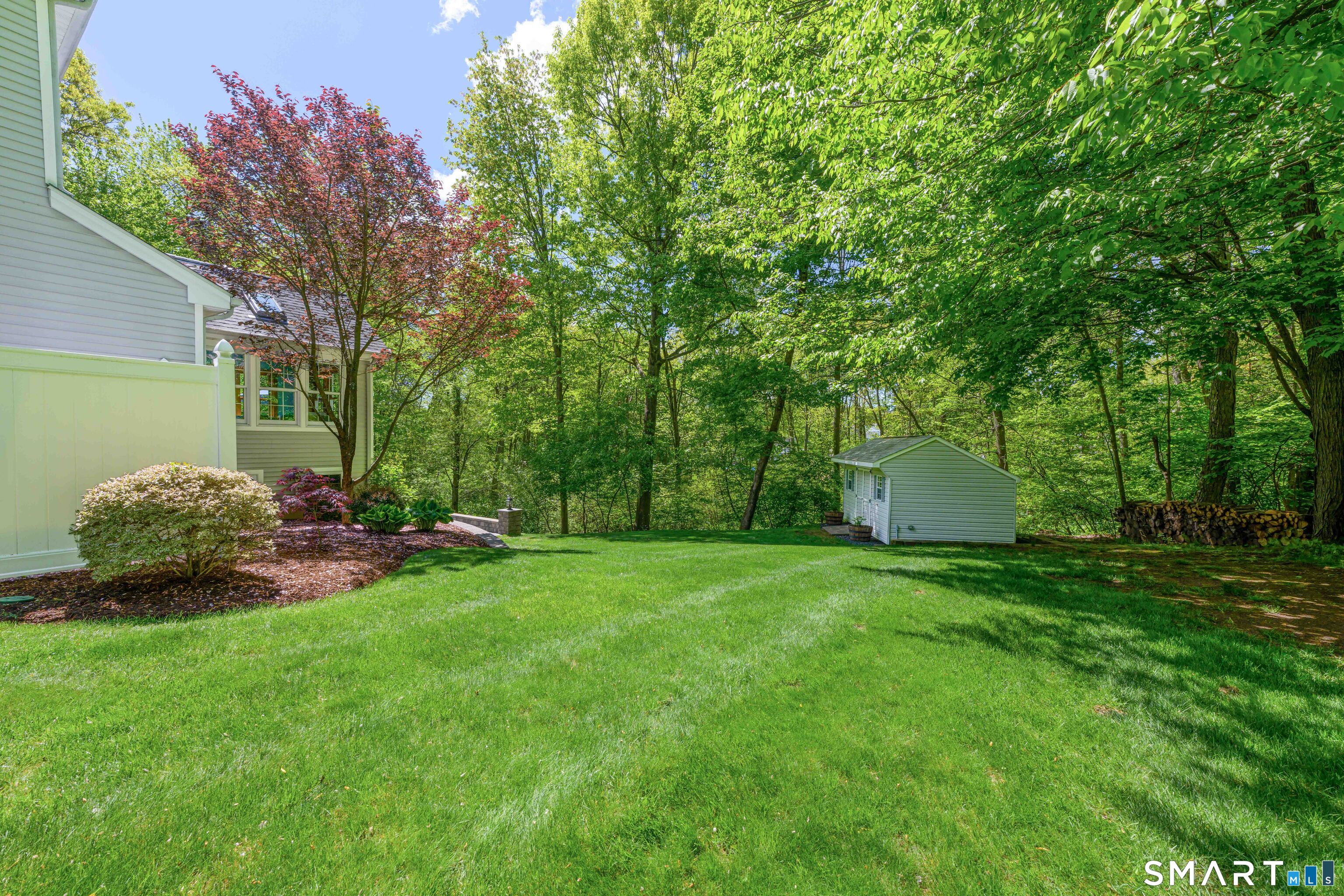4 Crystal Lane Wallingford, CT 06492 - Photo 38 of 40 a view of a backyard with garden