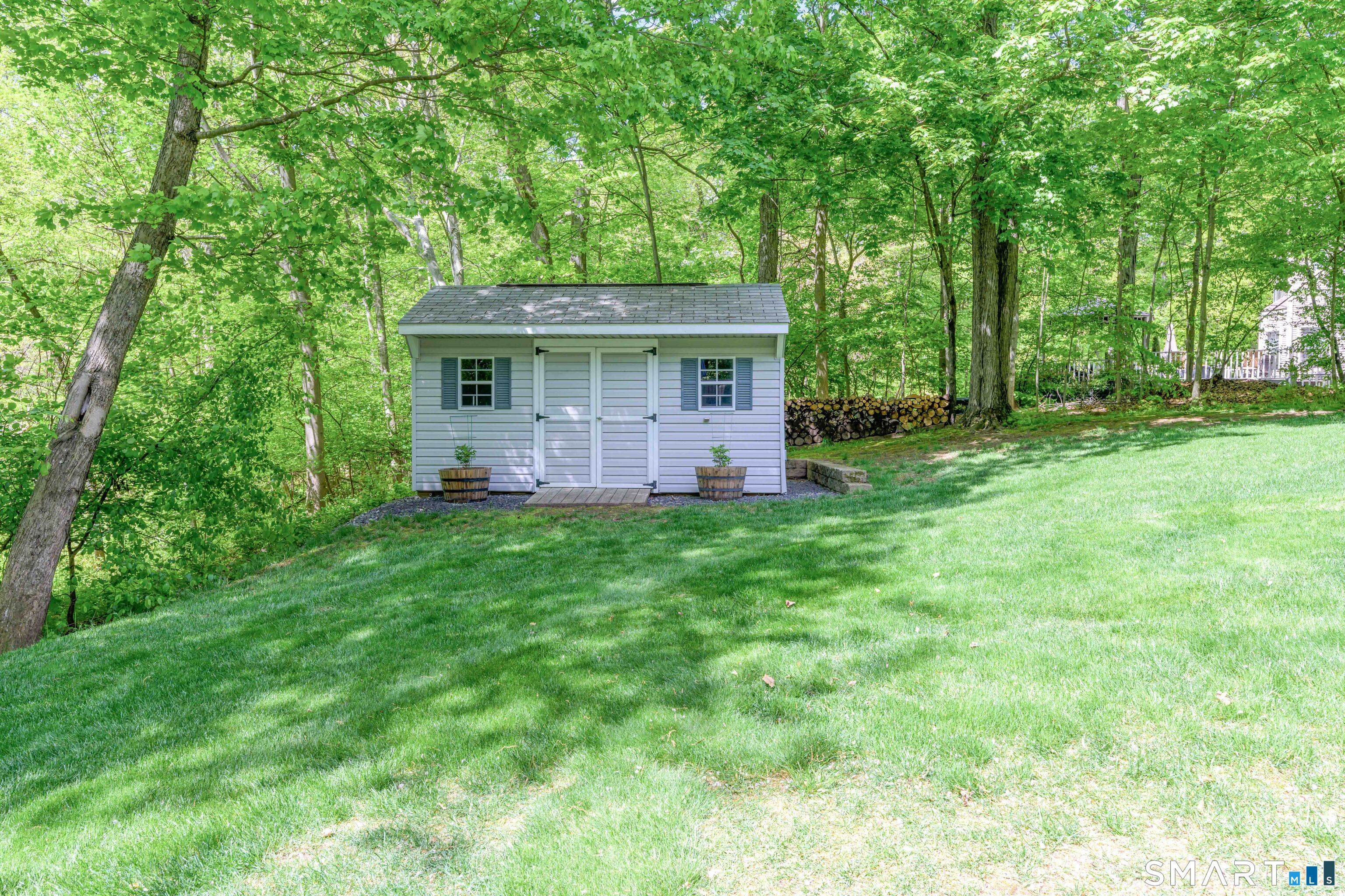 4 Crystal Lane Wallingford, CT 06492 - Photo 39 of 40 a view of a house with backyard and garden