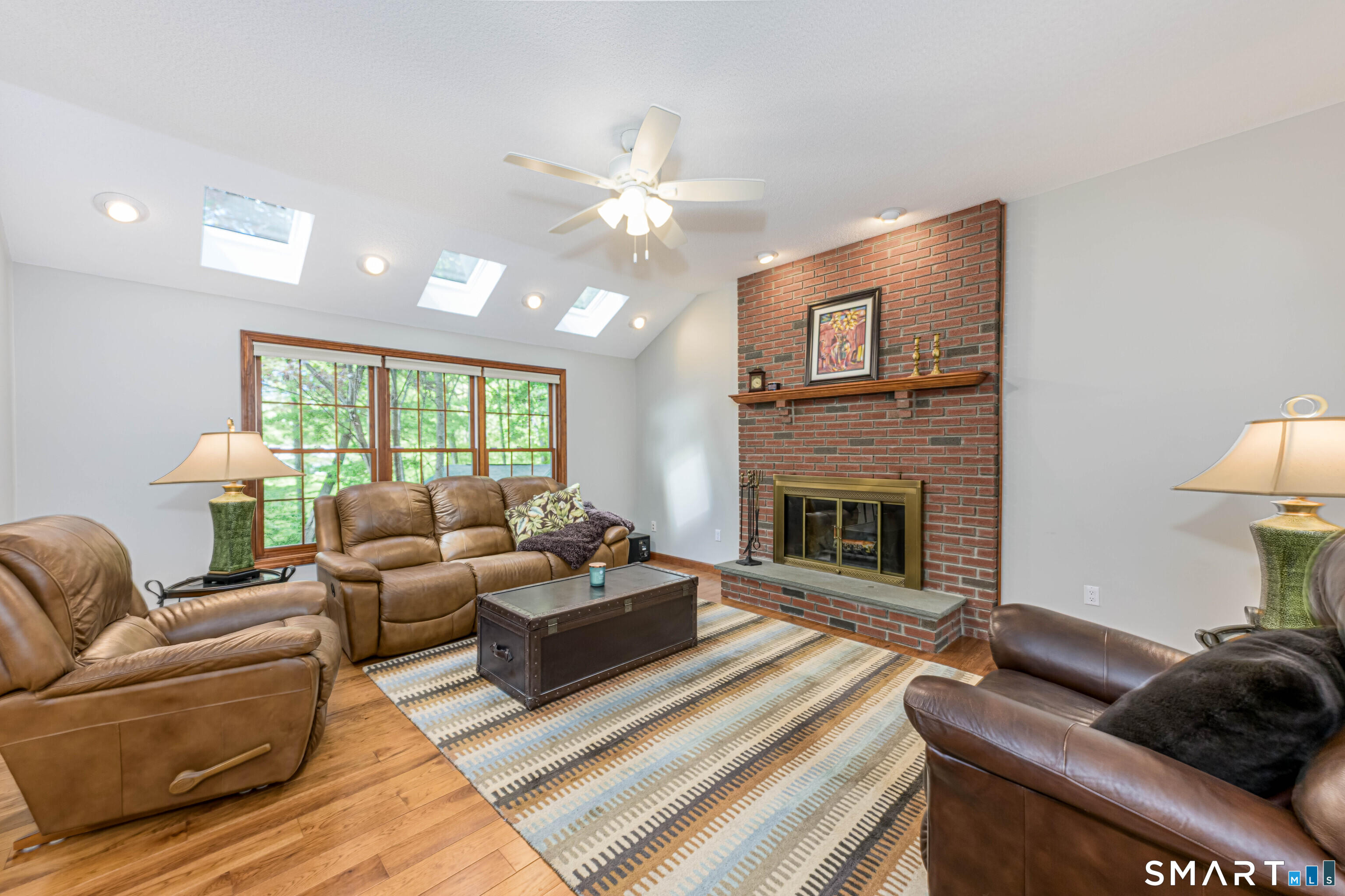 4 Crystal Lane Wallingford, CT 06492 - Photo 6 of 40 a living room with furniture a fireplace and a large window