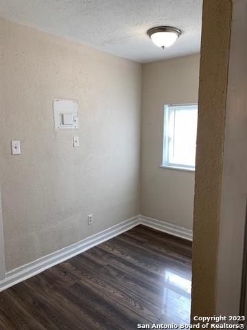 403 Terrell Avenue, Unit 3 San Antonio, TX 78214 - Photo 14 of 14 an empty room with wooden floor and windows