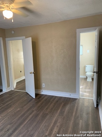 403 Terrell Avenue, Unit 3 San Antonio, TX 78214 - Photo 10 of 14 a view of a hallway with wooden floor and a bathroom