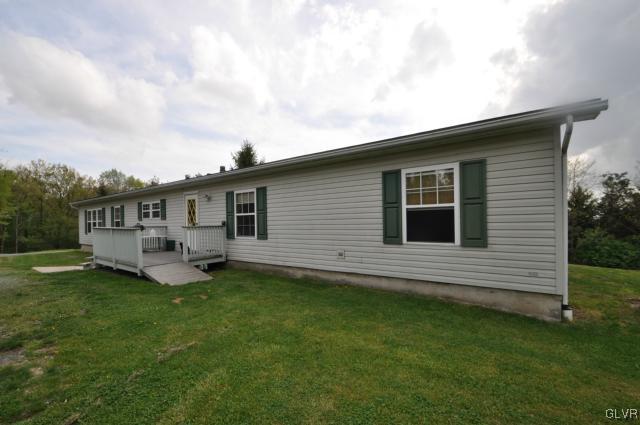 406 Levis Road Nazareth, PA 18064 - Photo 1 of 21 a front view of a house with a garden