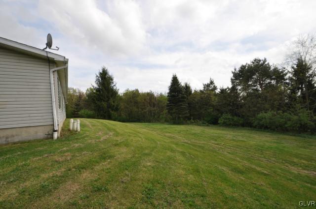 406 Levis Road Nazareth, PA 18064 - Photo 18 of 21 a backyard of a house with lots of green space