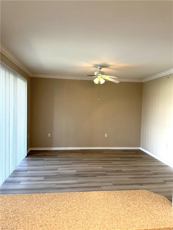 8490 Kingbird Loop, Unit 934 Estero, FL 33967 - Photo 30 of 33 a view of an empty room with wooden floor
