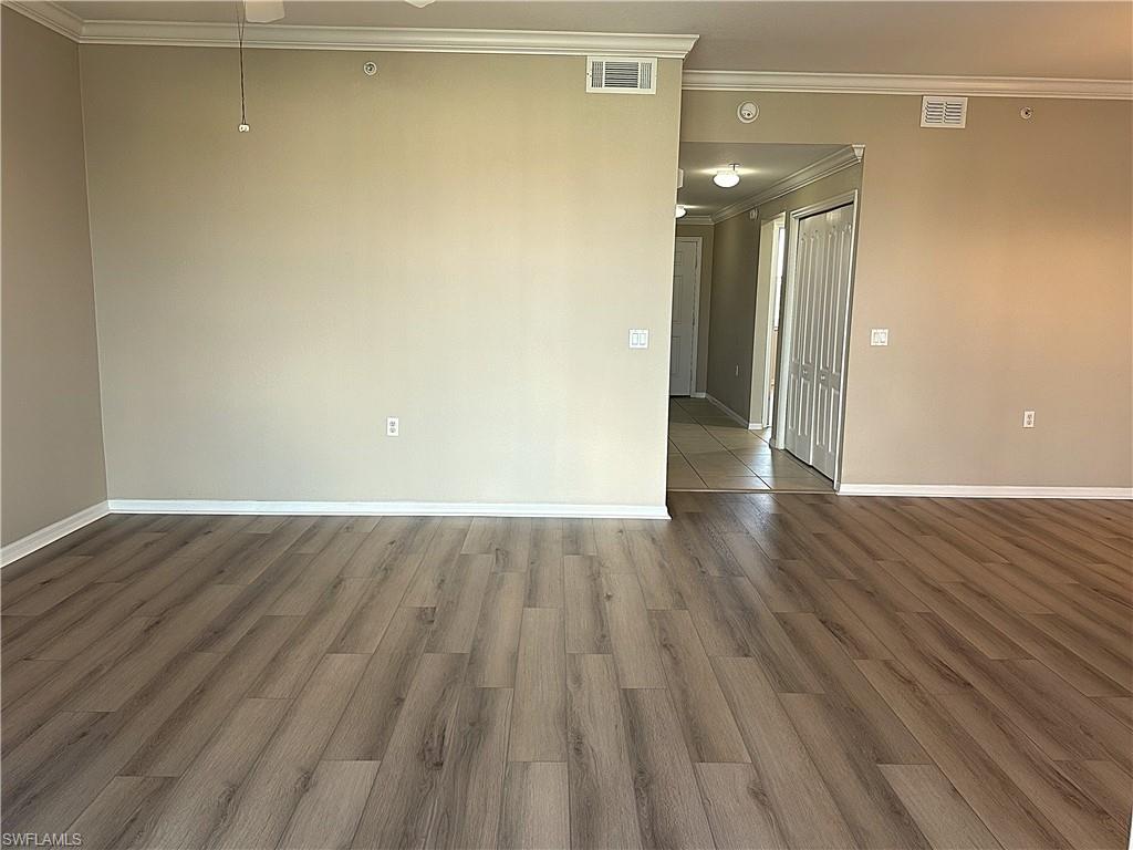 8490 Kingbird Loop, Unit 934 Estero, FL 33967 - Photo 5 of 33 a view of a room with wooden floor and a window