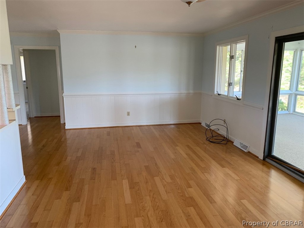 312 Eubank Landing Road Topping, VA 23169 - Photo 4 of 17 Living room area with wood floors.