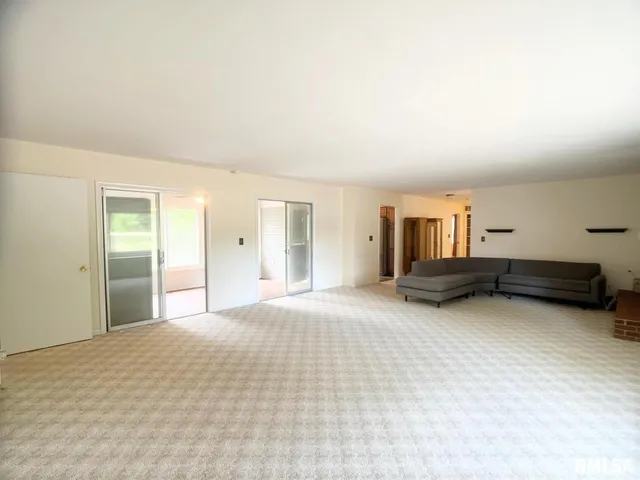a kitchen with stainless steel appliances granite countertop a sink stove and microwave