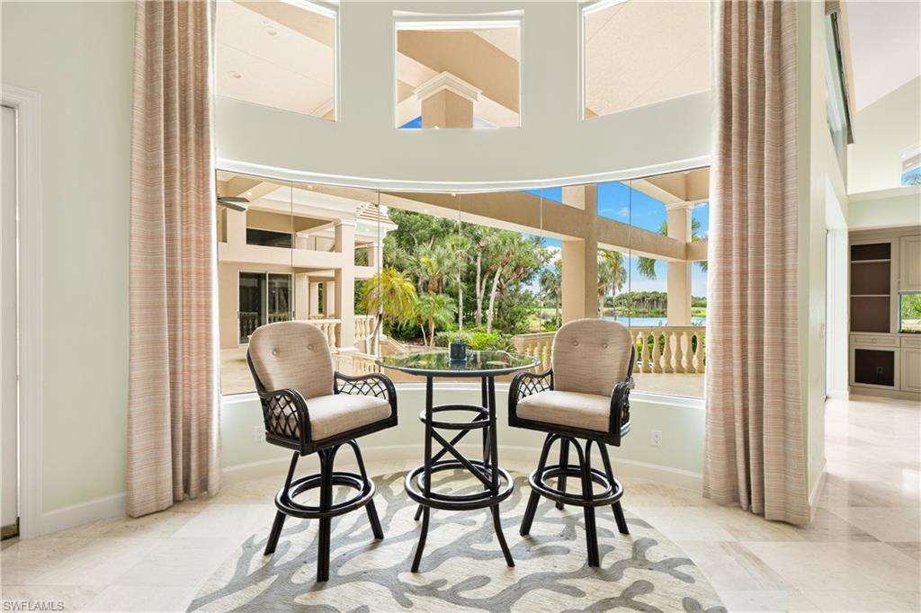 2969 Wulfert Road Sanibel, FL 33957 - Photo 11 of 44 a view of a chairs and table in a living room