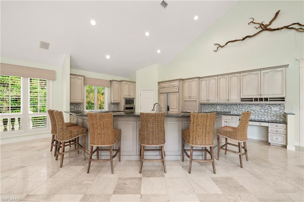 2969 Wulfert Road Sanibel, FL 33957 - Photo 14 of 44 a dining room with furniture and a floor to ceiling window