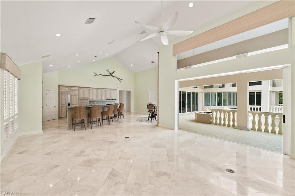 2969 Wulfert Road Sanibel, FL 33957 - Photo 18 of 44 a view of a big room with a large window and furniture