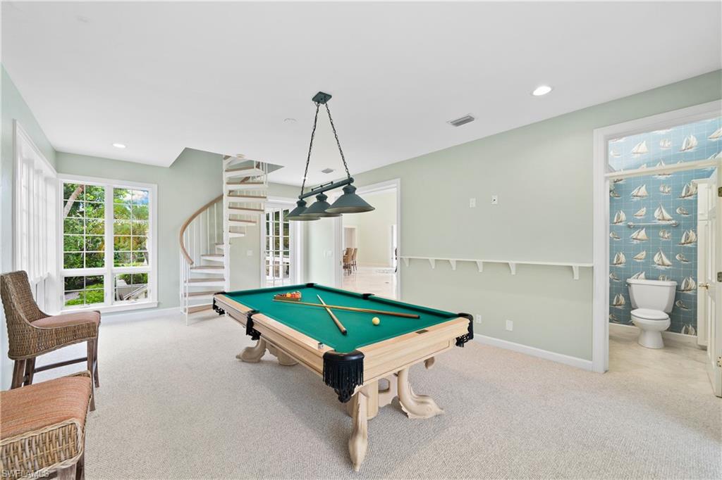 2969 Wulfert Road Sanibel, FL 33957 - Photo 20 of 44 a living room with furniture and a table