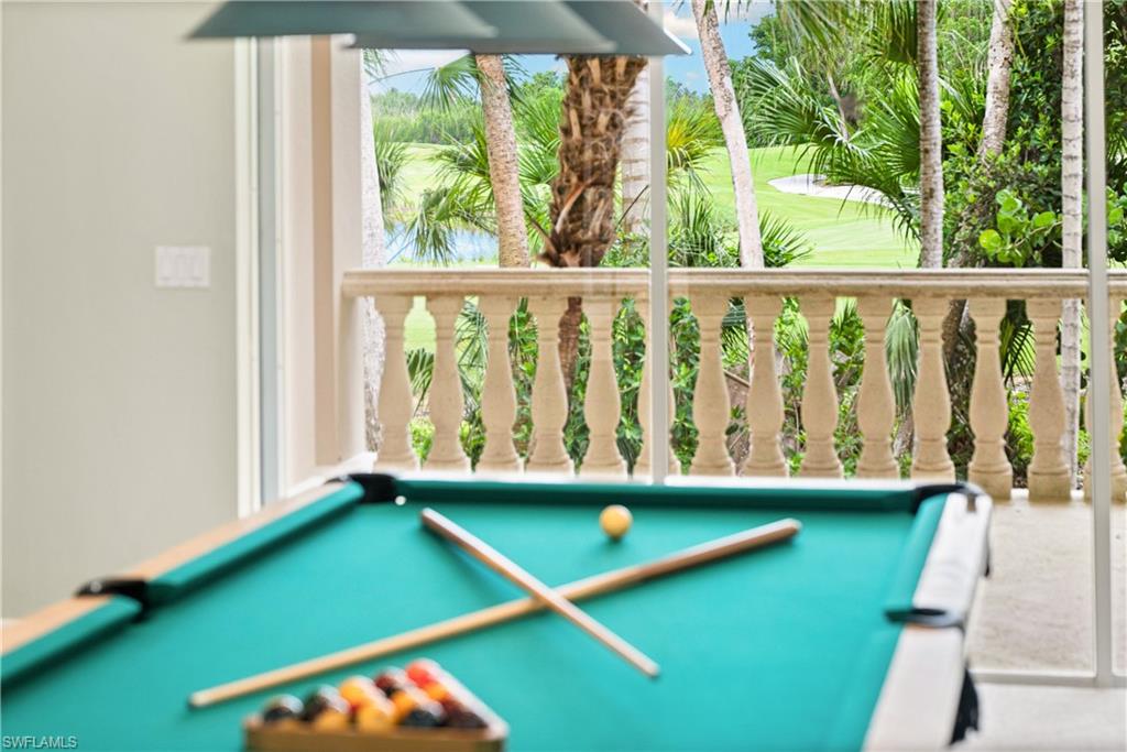 2969 Wulfert Road Sanibel, FL 33957 - Photo 22 of 44 a view of a pool with a floor to ceiling window