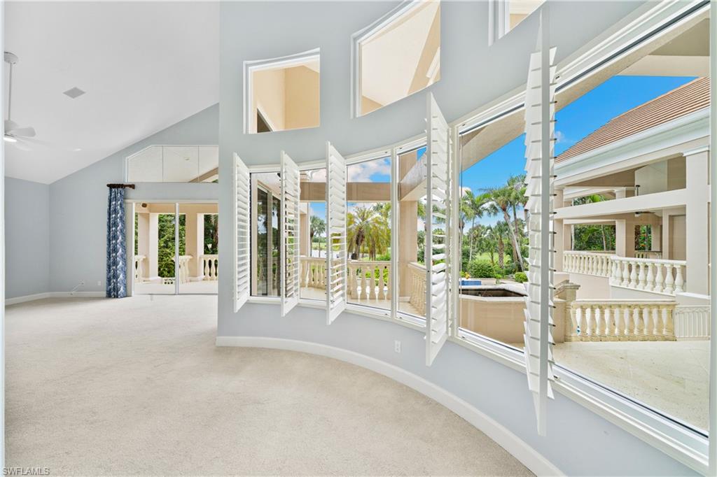 2969 Wulfert Road Sanibel, FL 33957 - Photo 26 of 44 a view of a building with a floor to ceiling window and a room