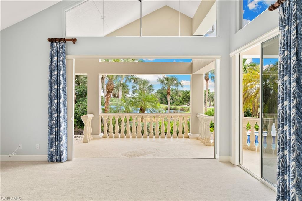 2969 Wulfert Road Sanibel, FL 33957 - Photo 30 of 44 a view of front door and porch with a floor to ceiling window