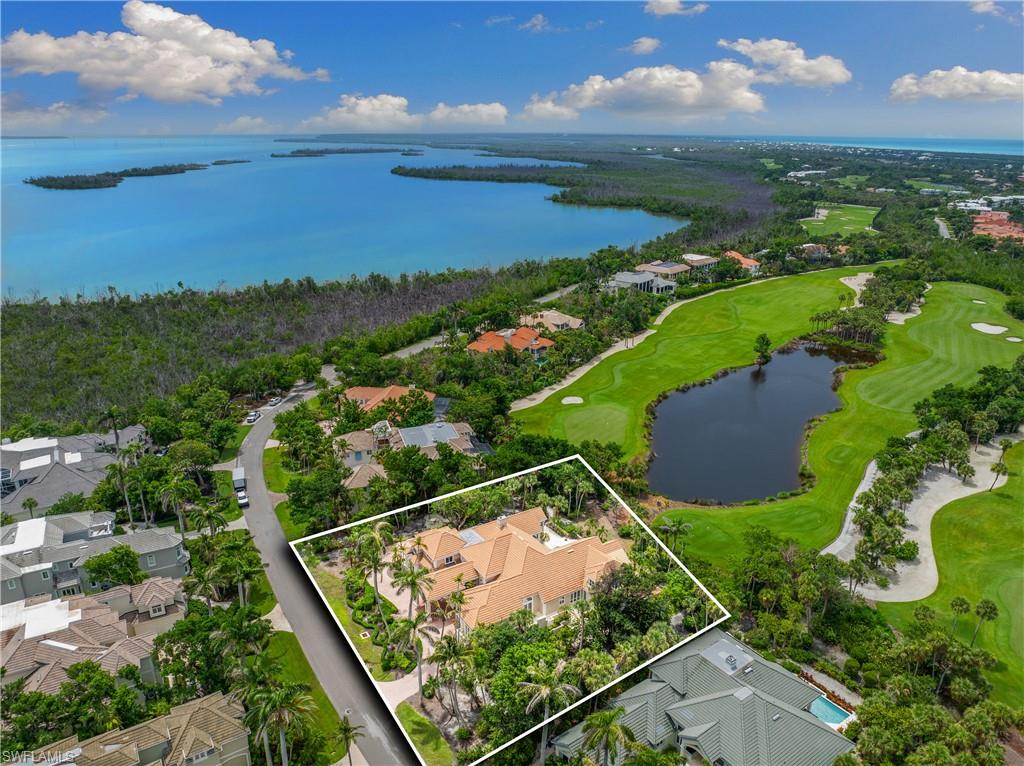 2969 Wulfert Road Sanibel, FL 33957 - Photo 3 of 44 an aerial view of ocean with residential houses with outdoor space and trees