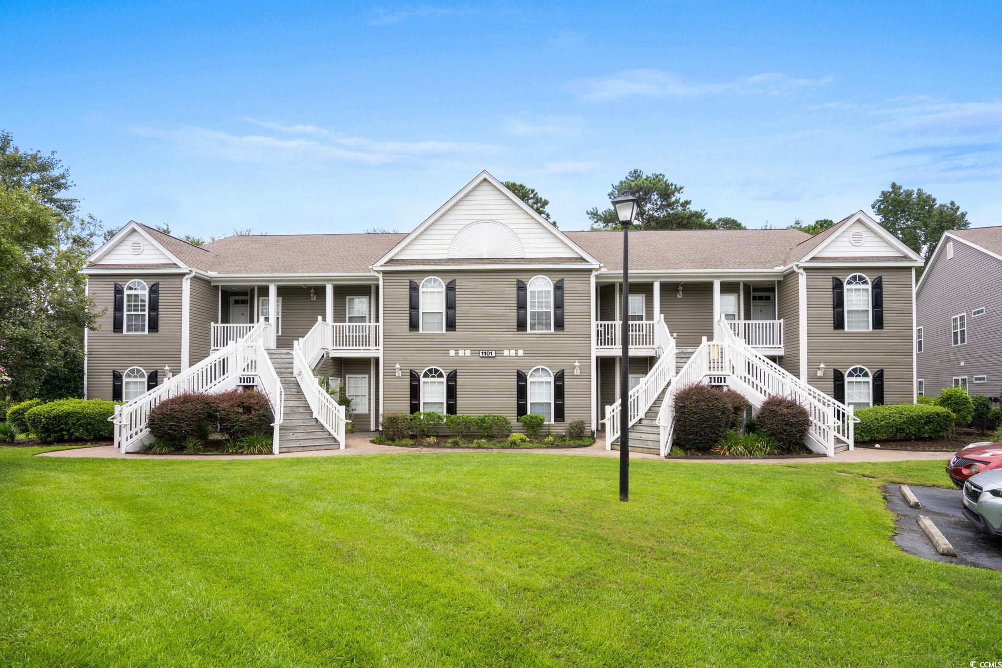 View of building exterior featuring stairway