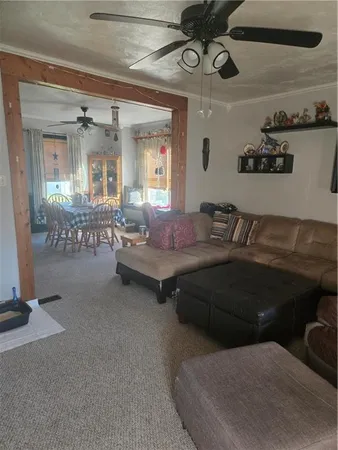 a living room with furniture and a clock