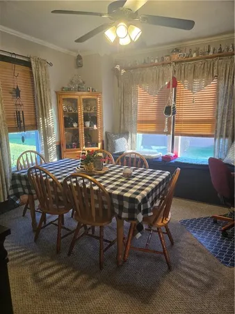 a dining room with furniture and window
