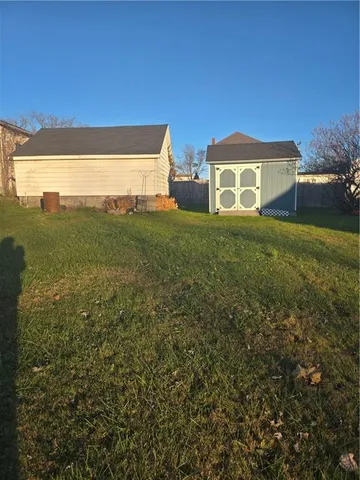 a view of a big yard with a house