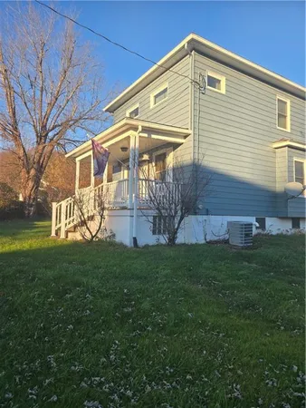 a front view of a house with a yard