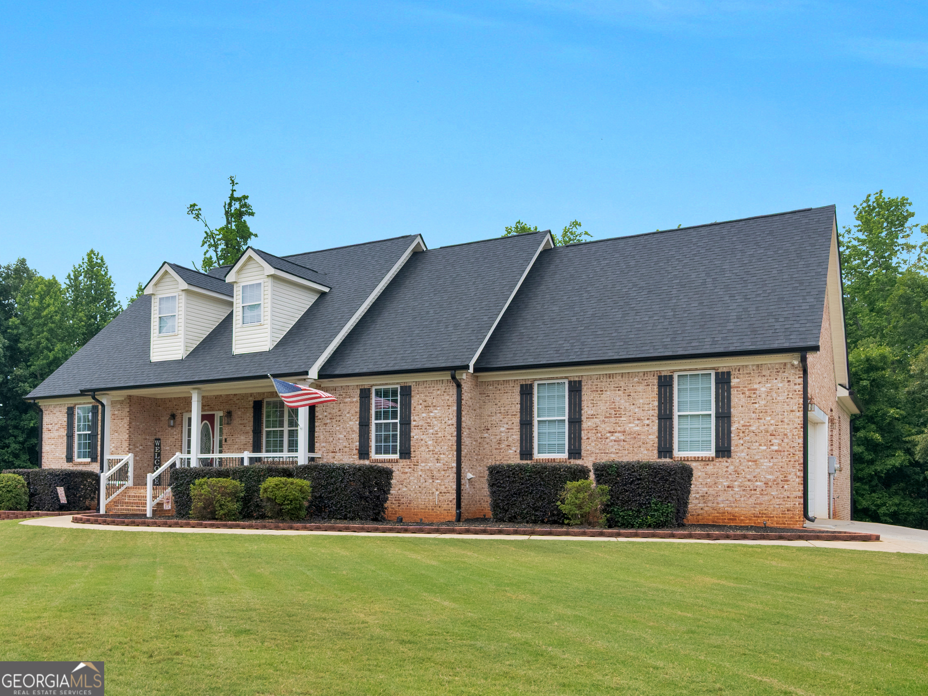 221 Hummingbird Court Hampton, GA 30228 - Photo 2 of 77 a front view of a house with a yard