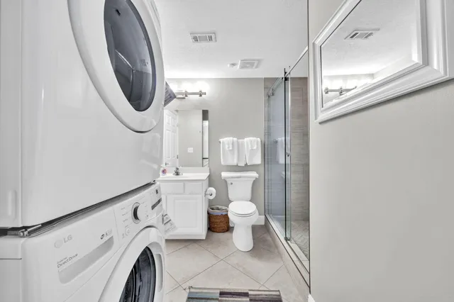 a bathroom with a toilet a sink and a mirror