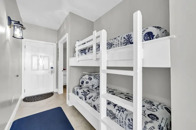 a view of bedroom with furniture and wooden floor