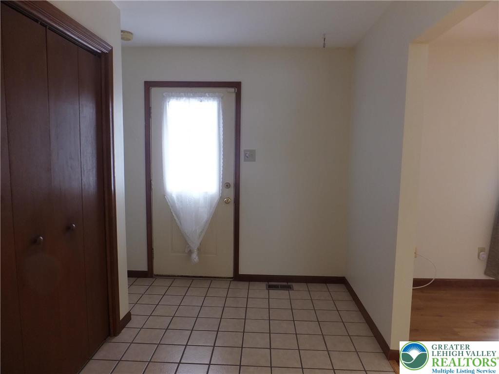 1207 Kressler Road Allentown, PA 18103 - Photo 2 of 27 a view of an empty room with closet and window