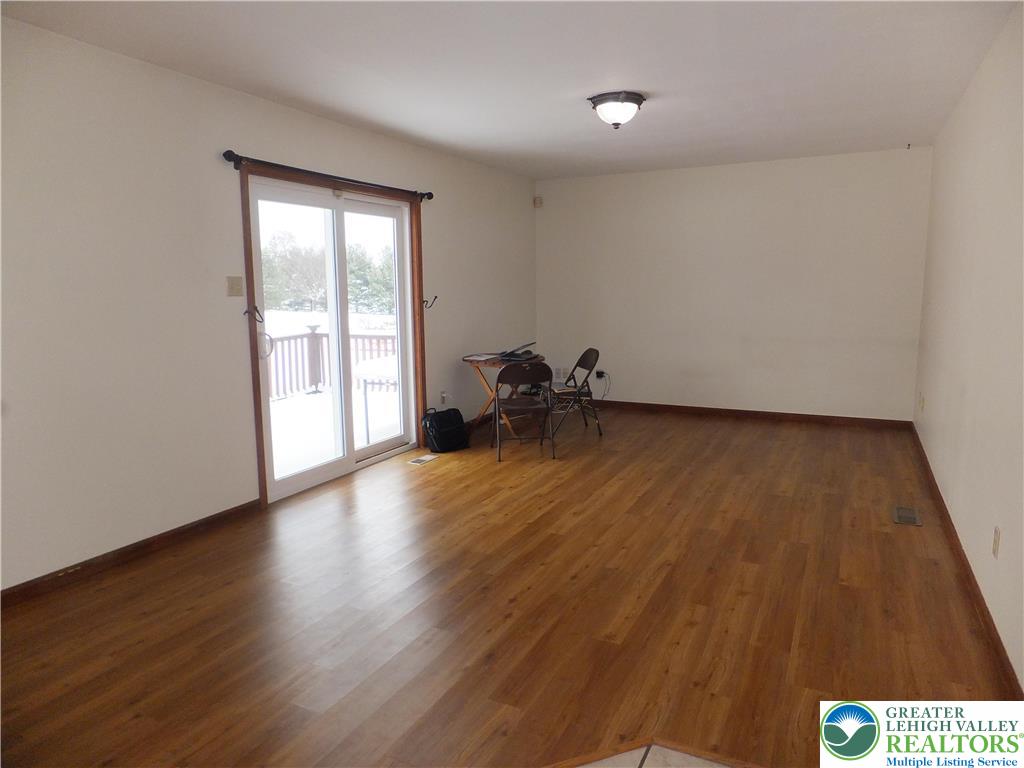 1207 Kressler Road Allentown, PA 18103 - Photo 8 of 27 wooden floor in an empty room with a window