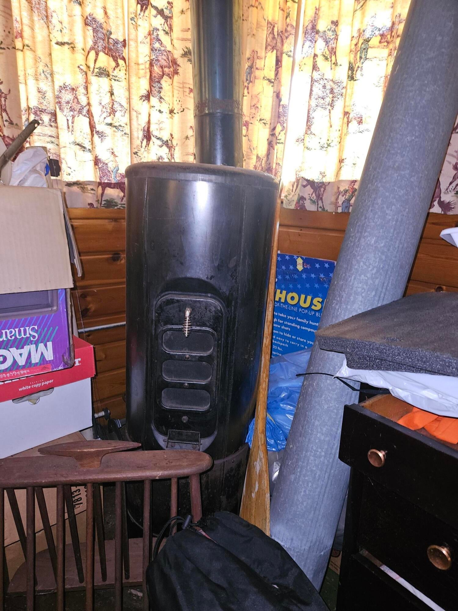 13025 Funk Road Hillman, MI 49746 - Photo 15 of 35 Fuel oil heater in bunk room