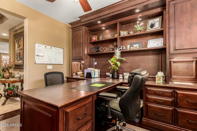 a view of a patio with table and chairs and potted plants