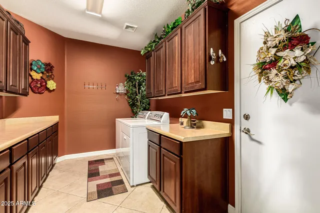 an aerial view of a house with a garden and lake view