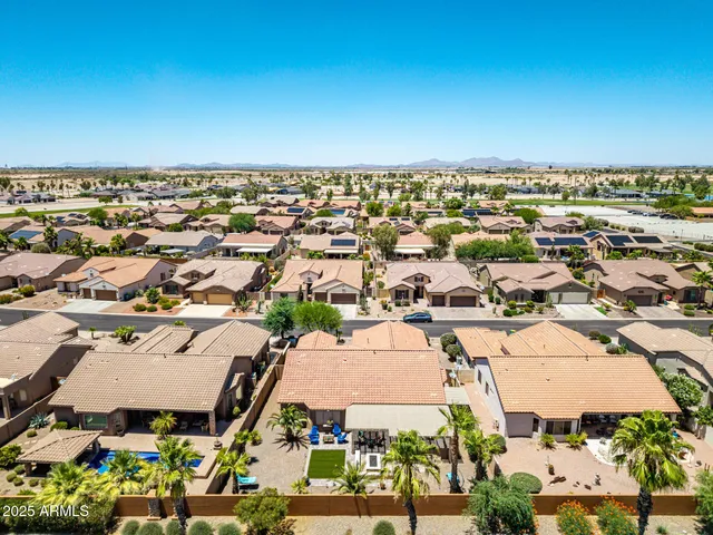 a living room with lots of furniture and a large window