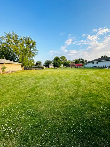 a view of an ocean and a yard