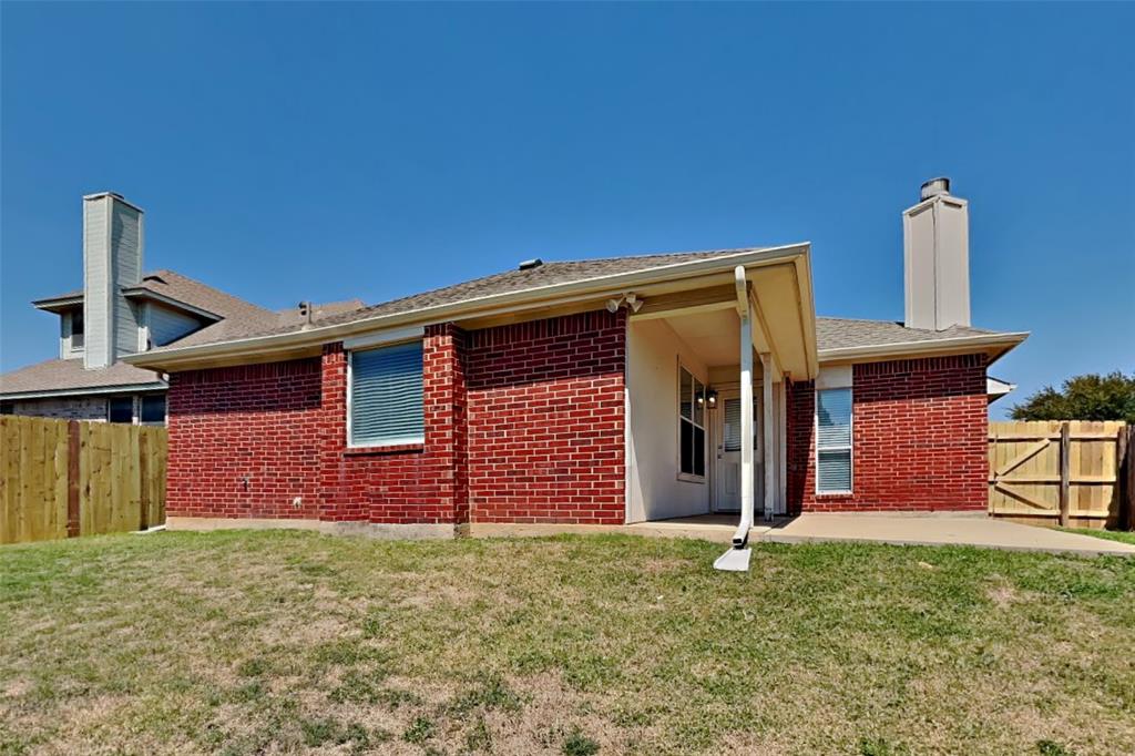 8404 Trinity Vista Trail Fort Worth, TX 76053 - Photo 17 of 18 Back of house featuring a chimney, brick siding, a patio area, and a shingled roof