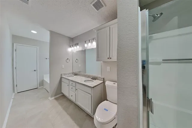 a bathroom with a toilet a sink and a mirror
