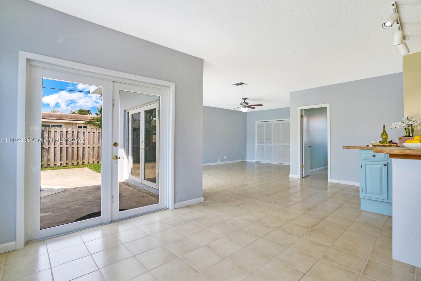5211 Northeast 26th Avenue Lighthouse Point, FL 33064 - Photo 21 of 43 workspace with wooden floor and windows