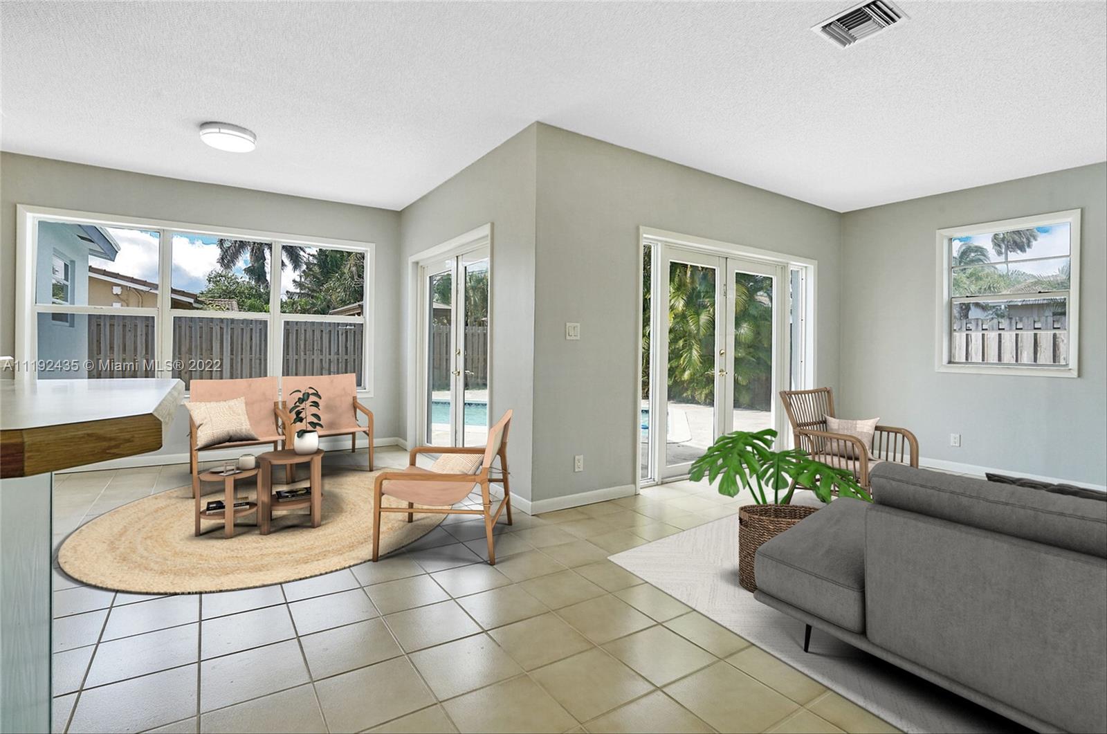 5211 Northeast 26th Avenue Lighthouse Point, FL 33064 - Photo 22 of 43 a living room with furniture and a potted plant
