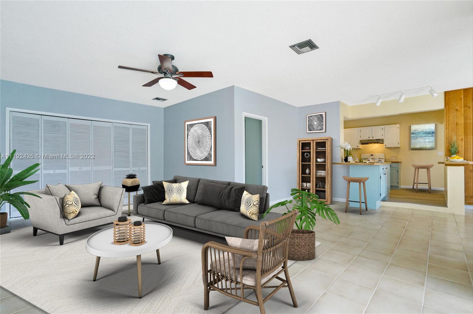5211 Northeast 26th Avenue Lighthouse Point, FL 33064 - Photo 24 of 43 a living room with furniture and wooden floor