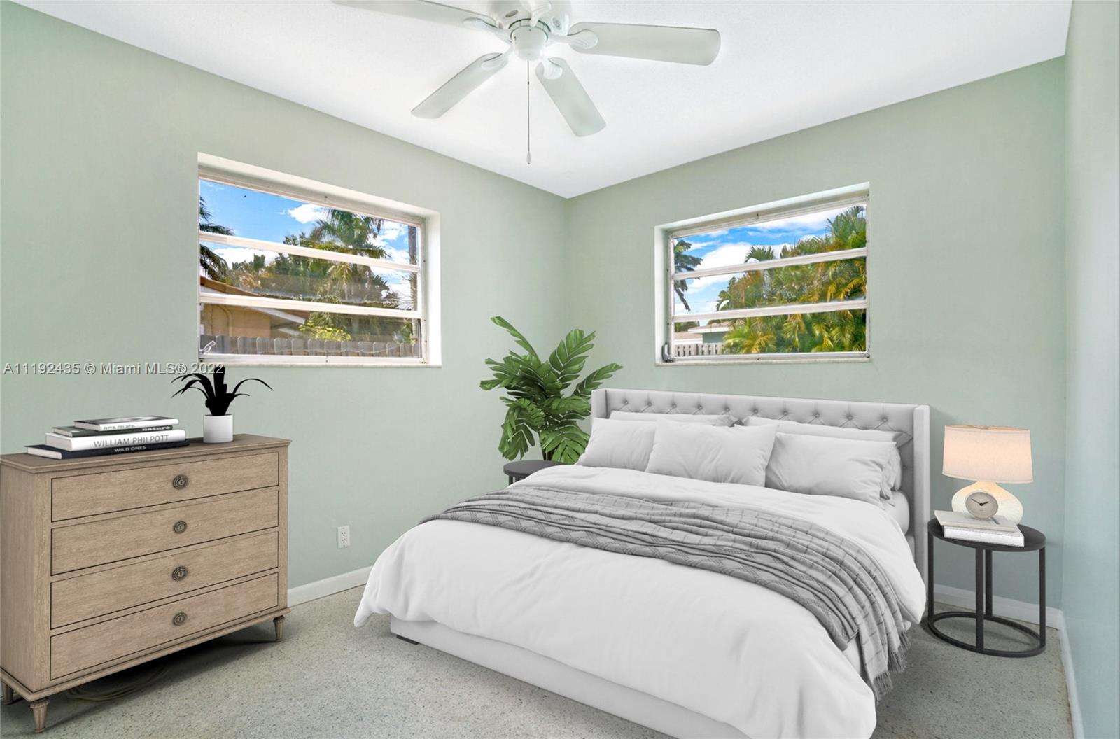 5211 Northeast 26th Avenue Lighthouse Point, FL 33064 - Photo 28 of 43 a bedroom with a bed and a painting on the wall