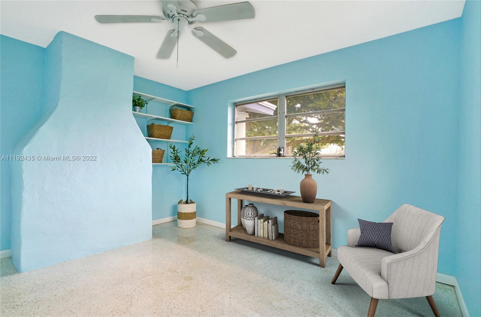 5211 Northeast 26th Avenue Lighthouse Point, FL 33064 - Photo 35 of 43 a living room with furniture and a potted plant