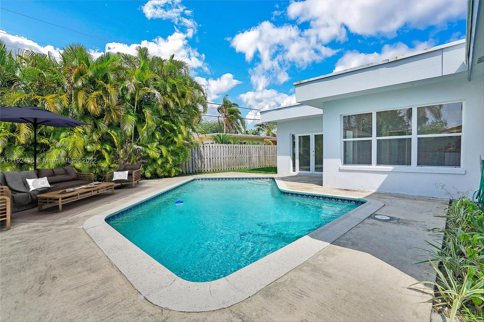 5211 Northeast 26th Avenue Lighthouse Point, FL 33064 - Photo 41 of 43 a view of a house with a backyard