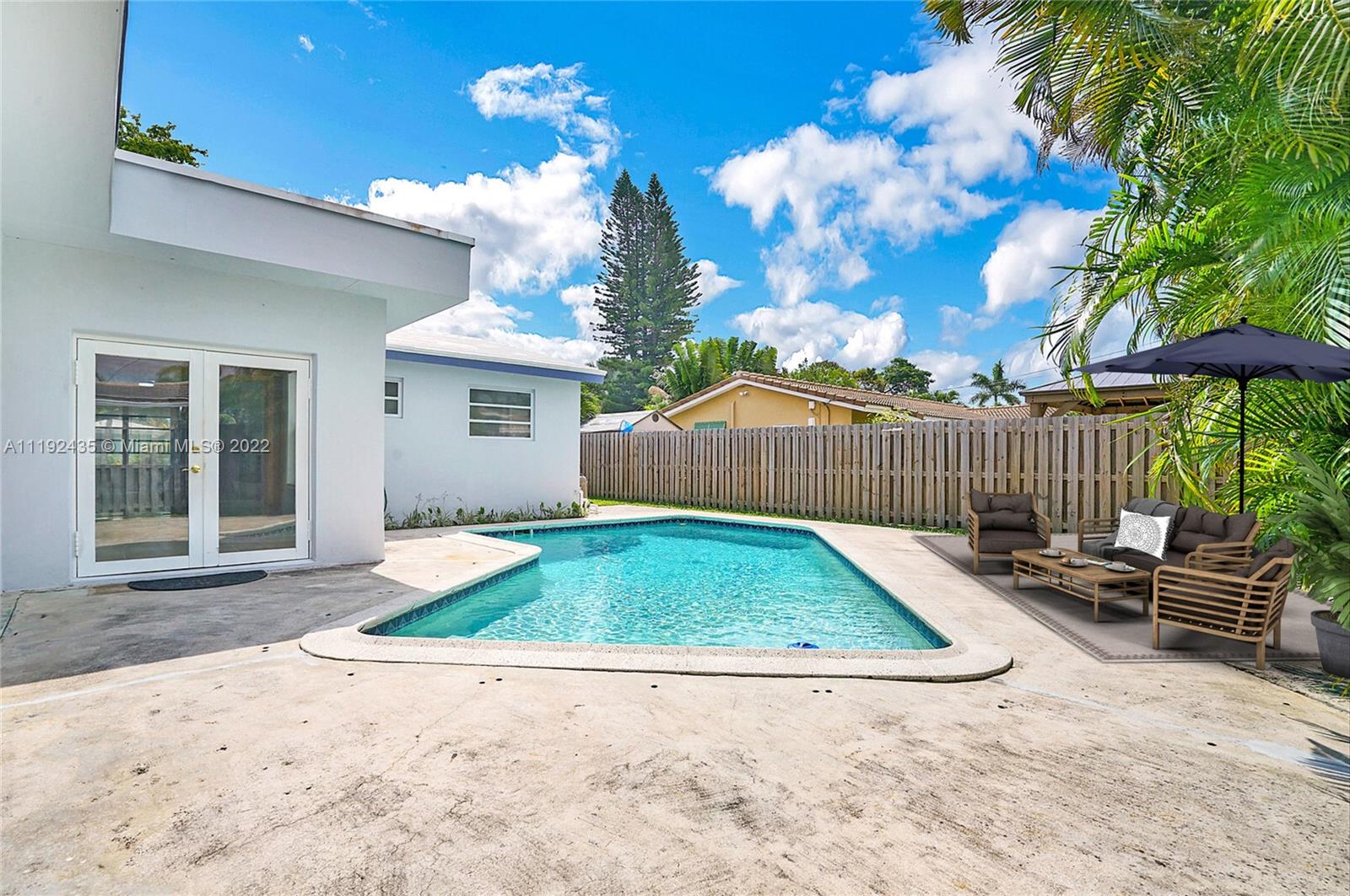 5211 Northeast 26th Avenue Lighthouse Point, FL 33064 - Photo 42 of 43 a view of backyard with seating space