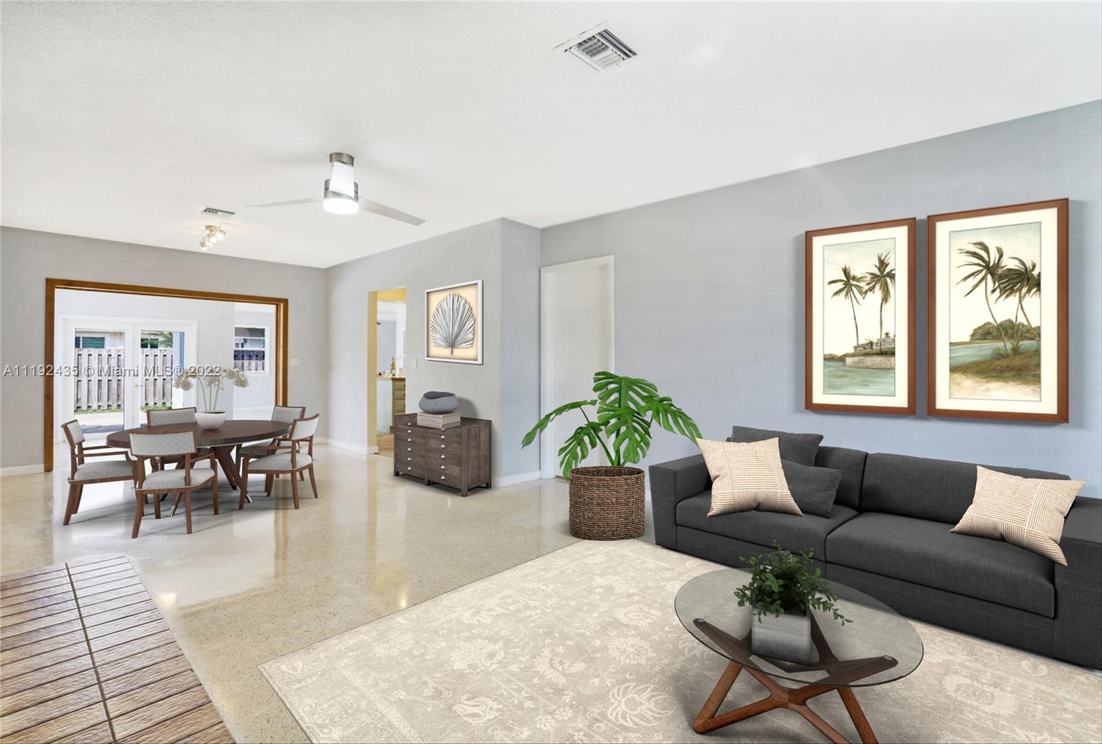 5211 Northeast 26th Avenue Lighthouse Point, FL 33064 - Photo 7 of 43 a living room with furniture and wooden floor