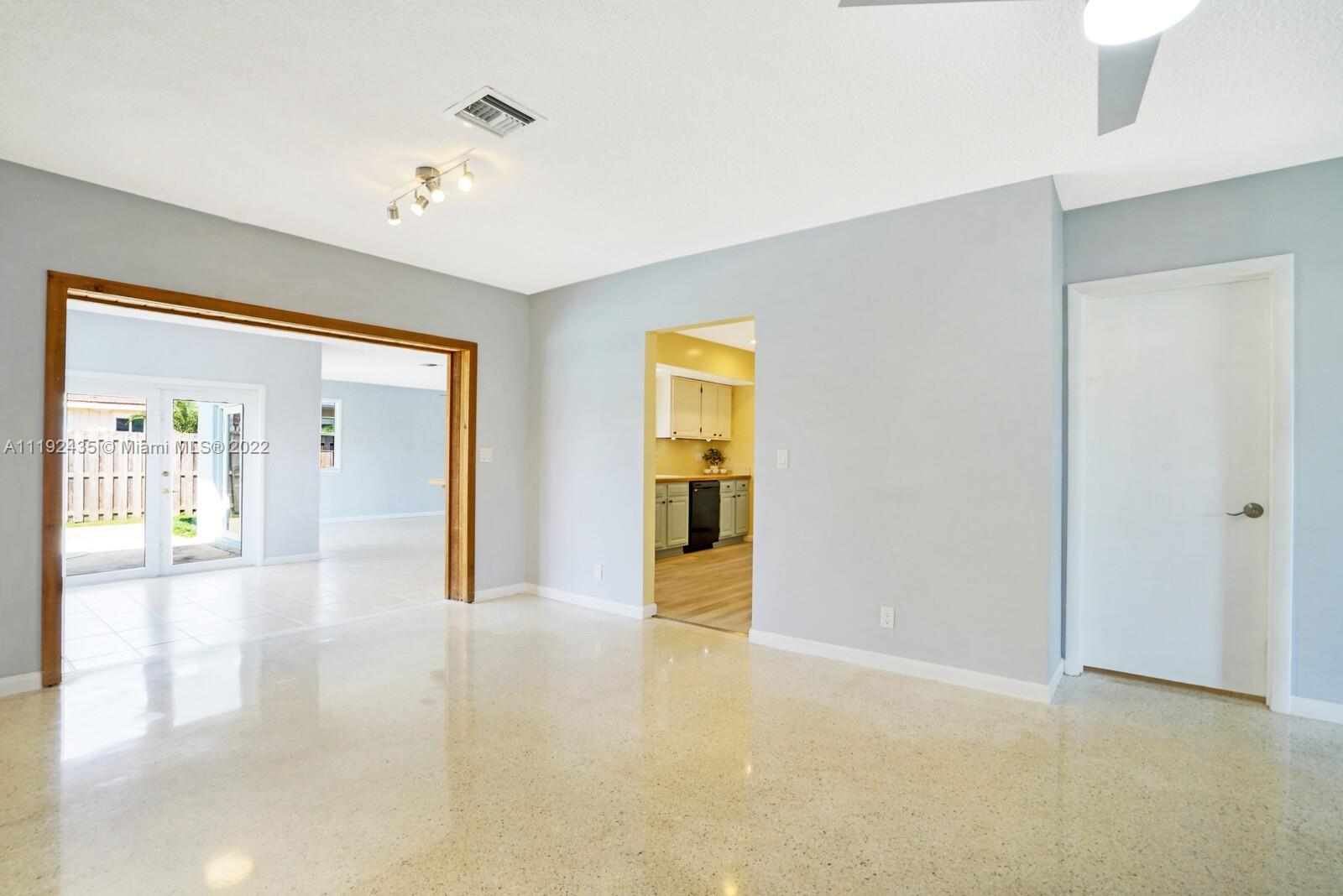 5211 Northeast 26th Avenue Lighthouse Point, FL 33064 - Photo 10 of 43 a view of an empty room with glass door