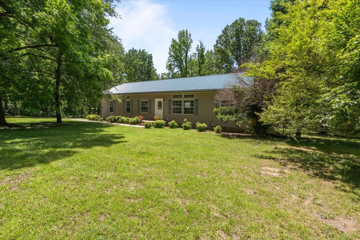 584 Highway 49 Tennessee Ridge, TN 37178 - Photo 1 of 1 a front view of house with yard and green space